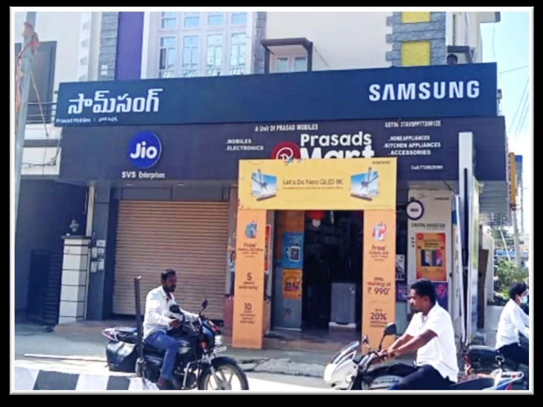 Samsung and Jio backlit boards at Prasad Mart, Tirupati